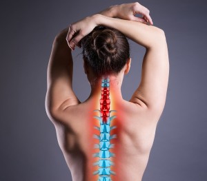 Pain,In,The,Spine,,Woman,With,Backache,On,Gray,Background,